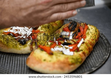 High resolution close up image of the preparation of a fresh and delicious Foccia bread- Israel