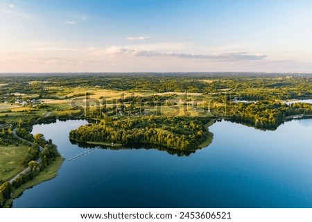 Beautiful aerial view of lake Galve, one of most popular lakes among water-based tourists, divers and holiday makers, located in Trakai, Lithuania. Royalty-Free Stock Photo #2453606521