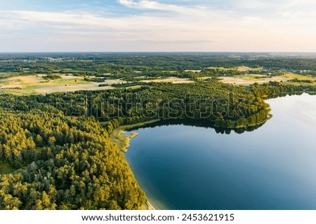 Beautiful aerial view of lake Galve, one of most popular lakes among water-based tourists, divers and holiday makers, located in Trakai, Lithuania. Royalty-Free Stock Photo #2453621915