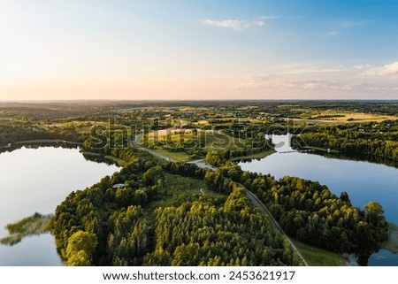 Beautiful aerial view of lake Galve, one of most popular lakes among water-based tourists, divers and holiday makers, located in Trakai, Lithuania. Royalty-Free Stock Photo #2453621917