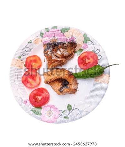 spicy fish dish in floral whit plate isolated on white background, fish dish.fish picture 