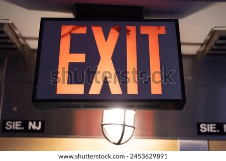 Exit sign on the side of the street in Manhattan - New York City.