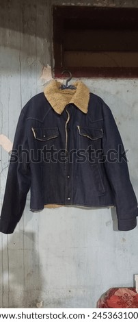 sherpa jeans jacket hanging on the wall