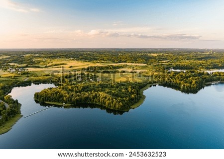 Beautiful aerial view of lake Galve, one of most popular lakes among water-based tourists, divers and holiday makers, located in Trakai, Lithuania. Royalty-Free Stock Photo #2453632523