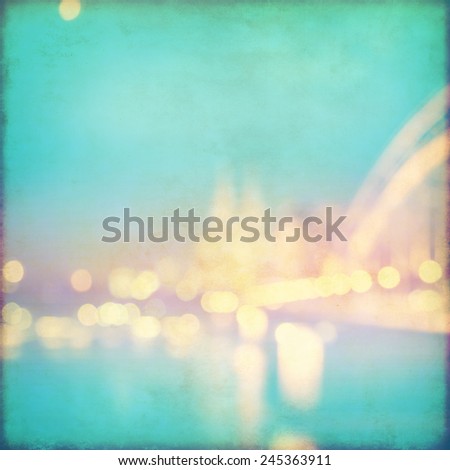 Abstract blurred cityscape background with bokeh effect. Grunge and retro style.