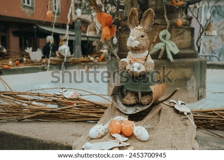 Straw Easter Bunny Display in a Festive Setting Royalty-Free Stock Photo #2453700945