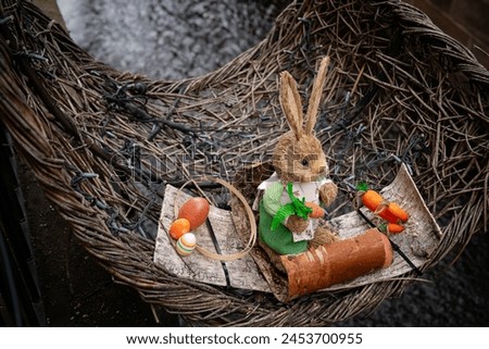 Easter Bunny Decoration with Eggs in Wicker Basket Royalty-Free Stock Photo #2453700955