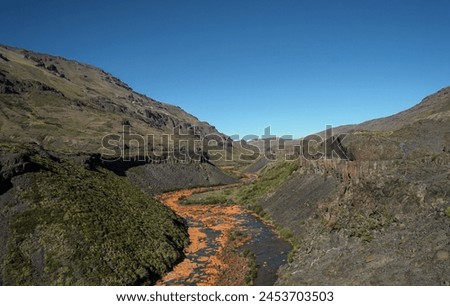 orange mountain river on a sunny day.
