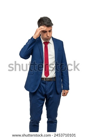 vertical remorseful expression of a businessman as he places his hand on his temple, displaying guilt and regret for his irresponsibility. With a culpable demeanor, white background Royalty-Free Stock Photo #2453710101