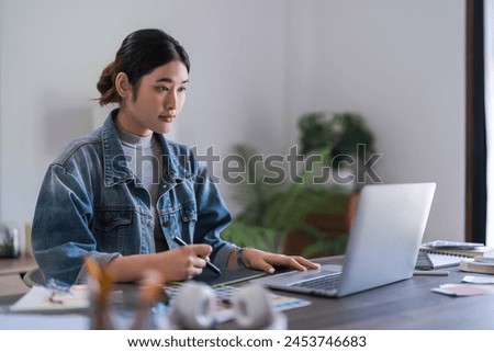 Graphic designer women working with laptop and digital tablet to designing about graphic design.