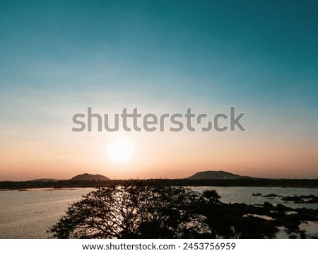 drone shot aerial view top angle beautiful natural scenery india tamilnadu lake seascape reflection sunrays twilight hours sunset dawn turquoise blue water bird sanctuary wallpaper tropical trees bank