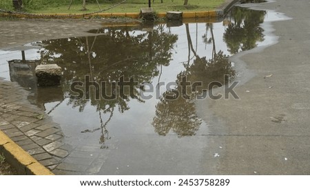 Waterlogged road conditions on the side of the highway during the day Royalty-Free Stock Photo #2453758289