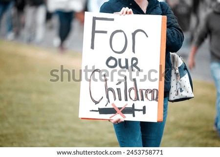 Banner, protest or woman with no vaccine for children sign at rally for covid, warning or fight. Government, politics and crowd with billboard for law, ban or poster for stop drug, crisis or disaster