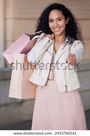 Woman, thumbs up and shopping bag in city with portrait, smile and excited for deal, sale or discount. Girl, happy and sign for yes, like and review of customer experience on metro sidewalk in Mexico