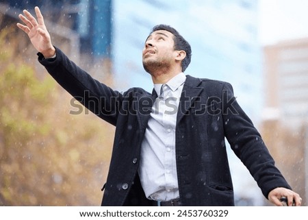 Business man, rain and waiting for taxi in street with thinking, sign and wave for driver in city. Person, sidewalk and hand to stop driver for ride, transport or travel with storm on commute to work