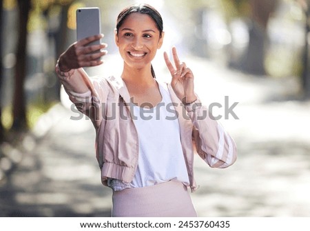 Fitness, woman and peace sign for selfie outdoor for social media, post update and profile picture with smile. Exercise, happy girl and hand gesture for photography, memory or walking in nature