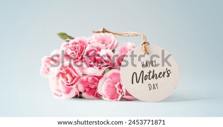 Mothers day card with pink flowers on vintage blue background