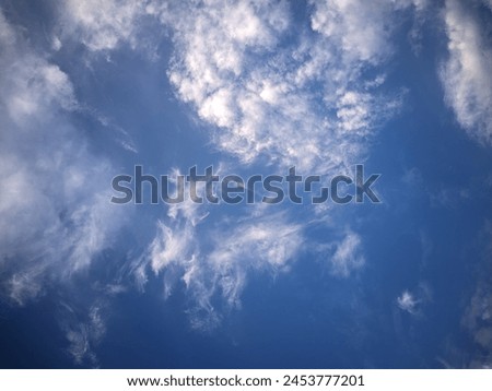 Cloud movement is a mesmerizing display of nature's fluid dynamics. It varies greatly depending on factors such as wind speed, altitude, and atmospheric conditions. Royalty-Free Stock Photo #2453777201