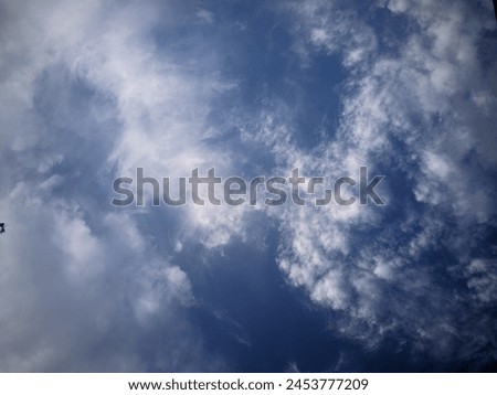 Cloud movement is a mesmerizing display of nature's fluid dynamics. It varies greatly depending on factors such as wind speed, altitude, and atmospheric conditions. Royalty-Free Stock Photo #2453777209