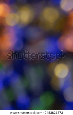 Defocused neon light. Overlay of light highlights. Futuristic abstract LED backlight. Blur of neon colors on dark abstract background