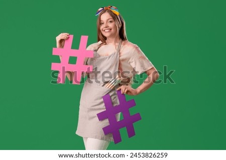 Female artist with hashtag signs on green background