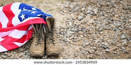 Military boots and USA flag outdoors. Banner for Memorial Day 