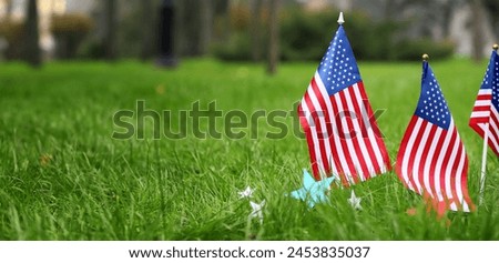 USA flags outdoors. Banner for Memorial Day celebration