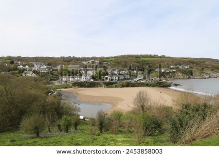 A view across the beautiful beach at Aberporth, Ceredigion, Wales, UK. Royalty-Free Stock Photo #2453858003