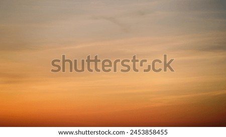 The sky at dusk was painted with a gradient of red and orange clouds, abstract background time lapse