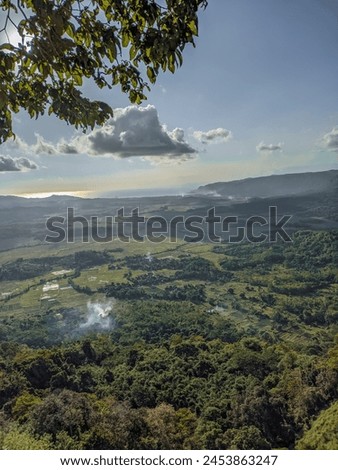 photo above the clouds with objects below the countryside 