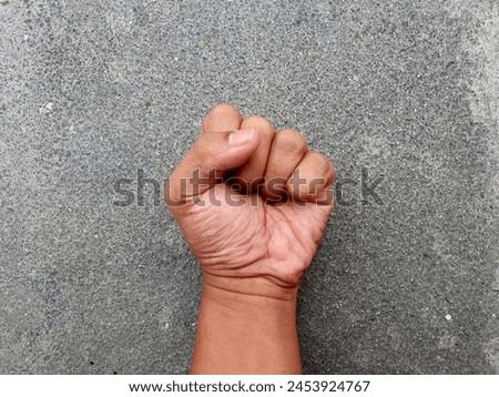Picture of a fist is a symbol of strength and enthusiasm to fight