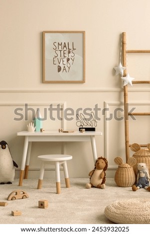Creative composition of cozy kids room interior with mock up poster frame, beige wall with stucco, white desk, stool, plush toys, garland on the wall and personal accessories. Home decor. Template.
