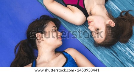 Beautiful attractive caucasian woman practice fitness yoga pose on the pool above the Mountain peak in front of nature lake views, Feel so comfortable lifestyle and relax exercise in holiday morning