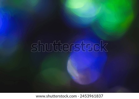 Defocused neon glow. Overlay of light highlights. Futuristic LED illumination. Blur of colored bokeh on dark abstract background