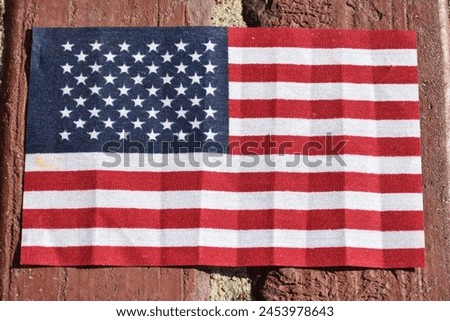 American flag with brick background