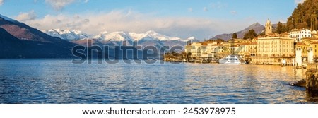 Panoramic view of Bellagio with snowcapped mountains in the background, Lake Como, Lombardy, Italian Lakes, Italy, Europe Royalty-Free Stock Photo #2453978975