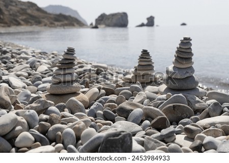 Stone Cairns with Aphrodite's Rock in Background