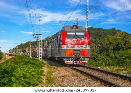 Cargo train on railway turn Royalty-Free Stock Photo #245399017