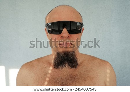 Men's beard. The guy's face is large. Brutal macho. Mustache and beard. Barber. Lumberjack. Portrait of a handsome man with a beard                                Royalty-Free Stock Photo #2454007543