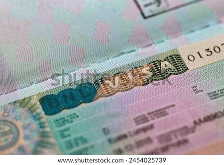 close up Netherlands Visa stamp on travel passport.  Royalty-Free Stock Photo #2454025739