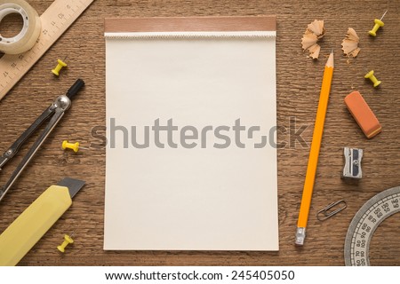School supplies on wooden background  