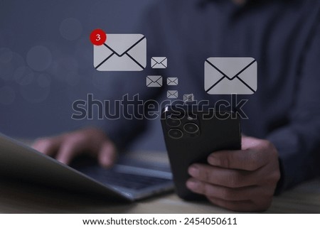Businessman uses computer with communication concept and inbox notification from email for interaction. Send and receive electronic messages via the Internet online for professional communication.