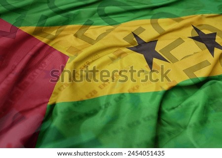 waving colorful national flag of sao tome and principe on a euro money banknotes background. finance concept . macro shot Royalty-Free Stock Photo #2454051435