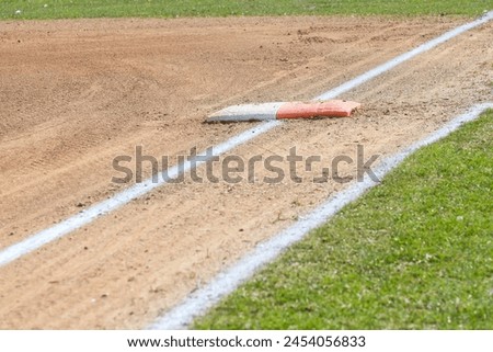 close up looking down the first base line on a softball field 