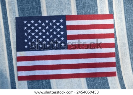 American flag on blue and white background