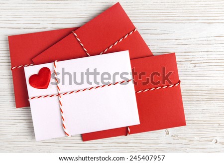 Envelope Mail, Red Heart and Ribbon over White Wooden Background. Valentine Day Card, Love or Wedding Greeting Concept Royalty-Free Stock Photo #245407957