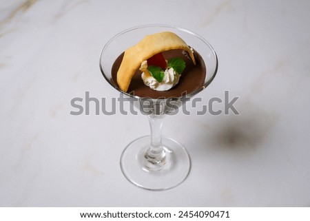 Image of liquid and delicious chocolate dessert styled with a minimalist concept