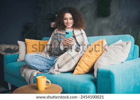 Photo of adorable pretty cute woman dressed stylish clothes reading news in cozy apartment daylight indoors