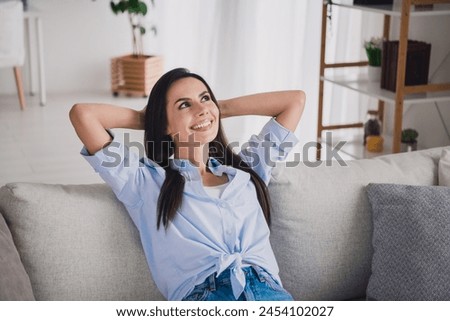 Portrait of pretty lady sit sofa inspiration wear shirt bright interior apartment indoors