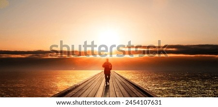 
Male person on a forest road in the headlights as a shadowy silhouette Royalty-Free Stock Photo #2454107631